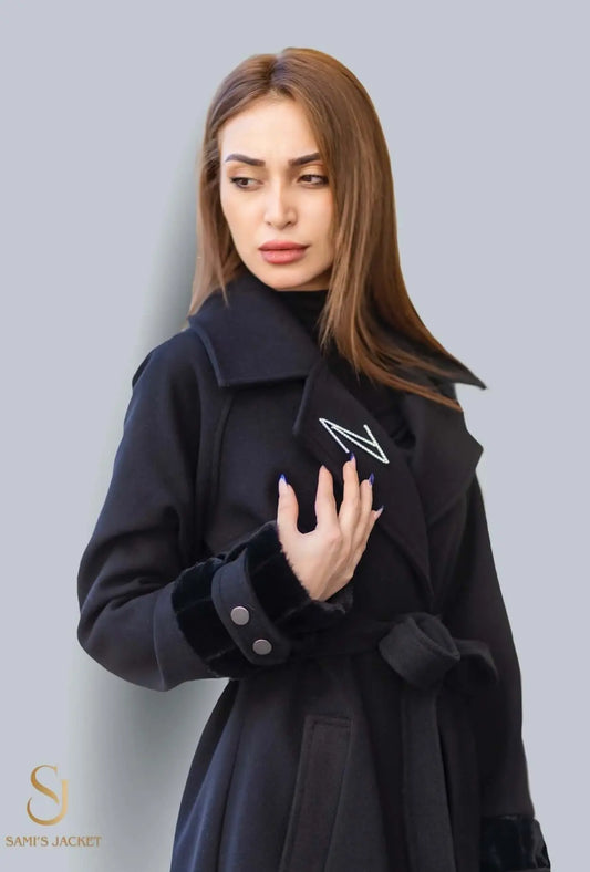 Elegant woman wearing the Model 1049 black winter coat, showcasing its stylish design and luxurious texture.