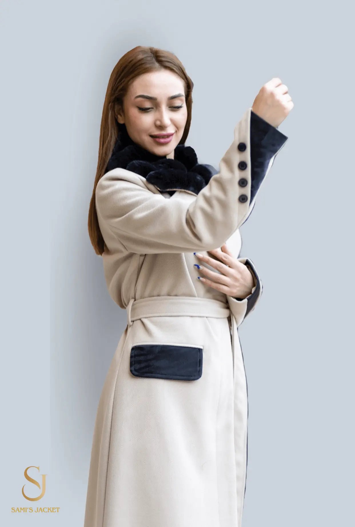 Woman in stylish beige winter coat with black details, showcasing elegant design and warmth. Perfect for winter fashion.