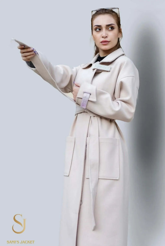 Elegant woman in long cream winter coat, showcasing stylish design and practical pockets for cold weather protection.