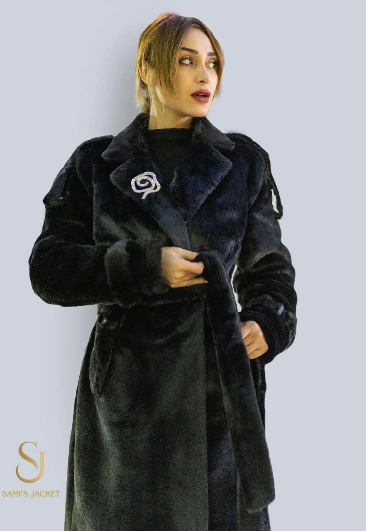 Stylish woman wearing a chic black winter coat, ideal for cold weather and sophisticated outfits.