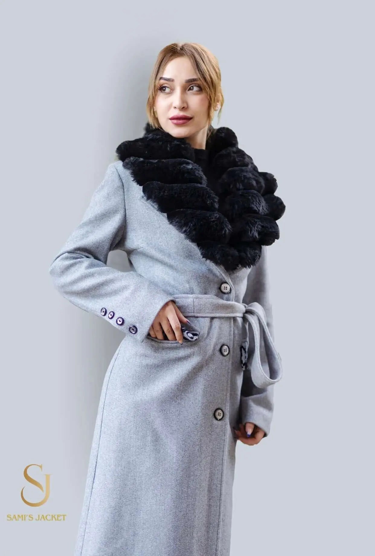 Stylish long coat Model 1041 with a black fur collar, perfect for winter fashion and warm layering for women.