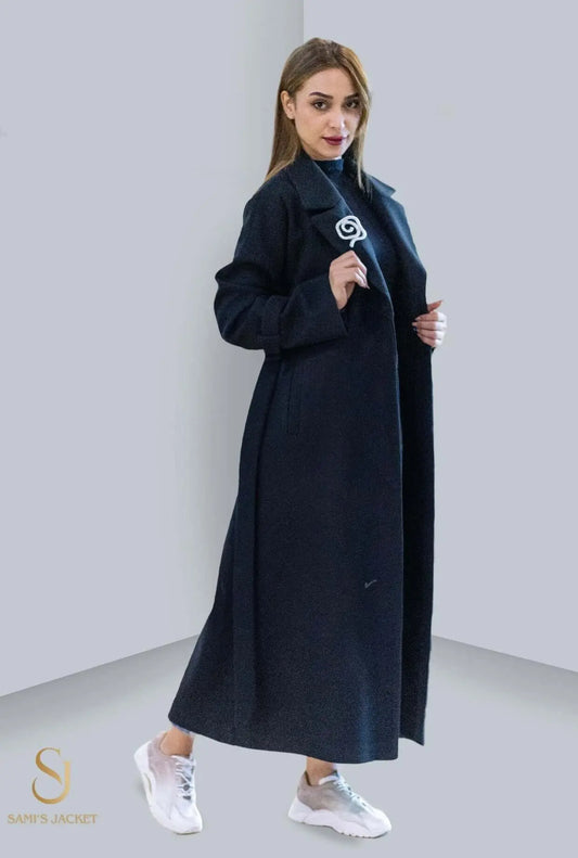 Elegant woman wearing a long black winter coat, highlighting sophisticated style for women's winter fashion.