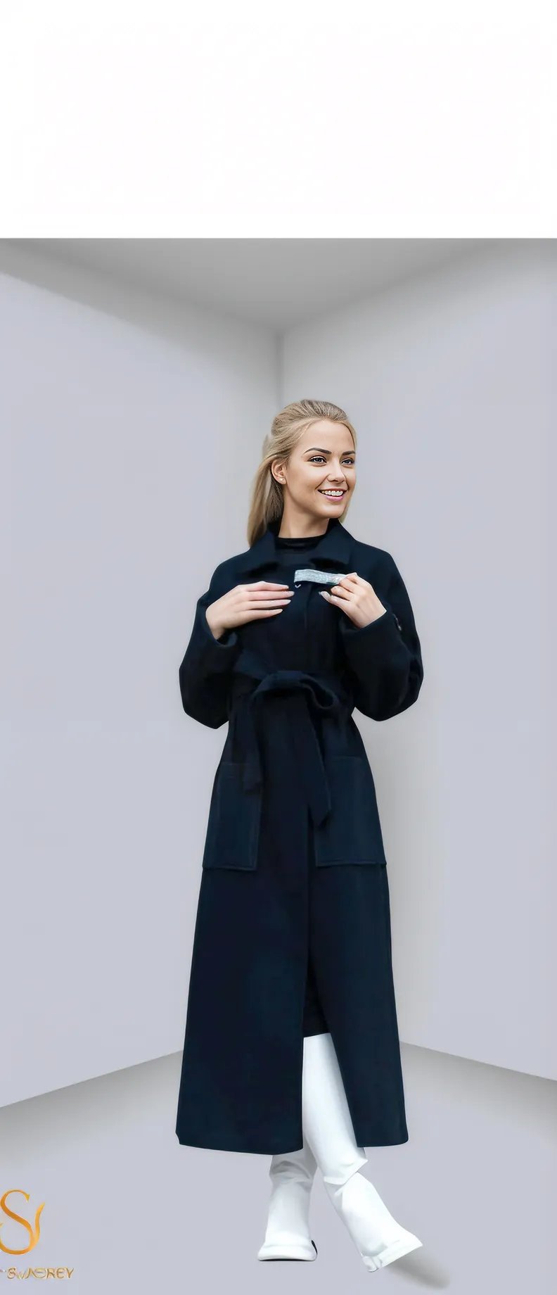 Stylish woman in a long black winter coat with belted waist, showcasing elegance and warmth for women’s winter fashion.