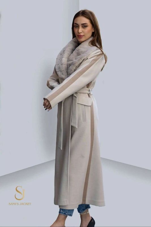 Elegant long winter coat with a fur collar, perfect for stylish cold weather looks for women.