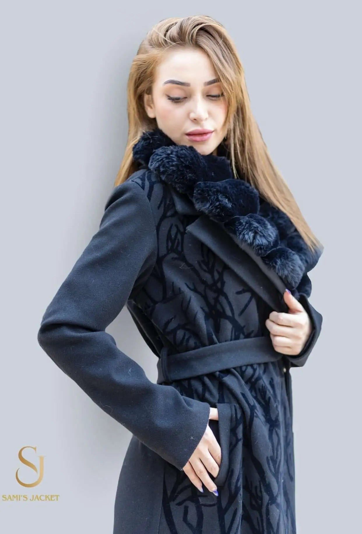 Woman modeling stylish Model 1046 winter coat with elegant design and luxurious texture, perfect for winter occasions.