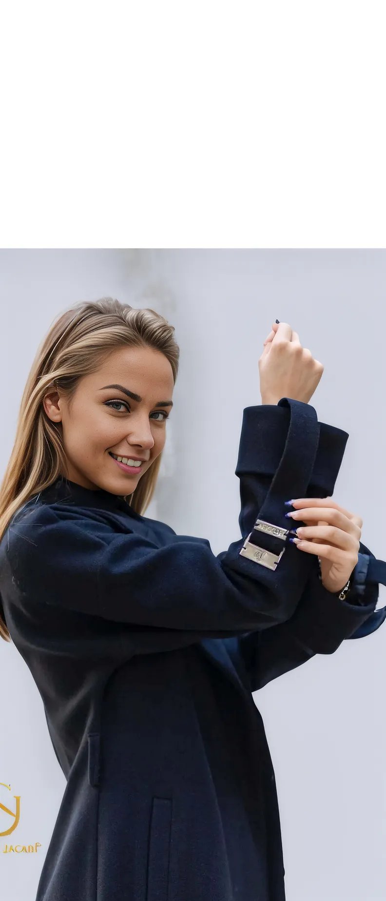 Stylish woman adjusting the cuff of a high-quality winter coat, showcasing elegance and warmth in winter fashion.