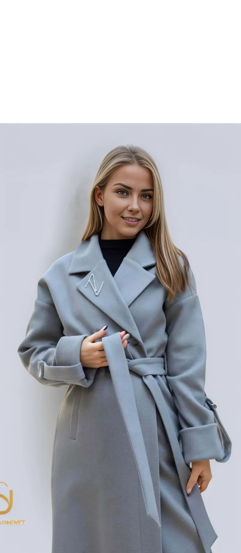 Stylish grey winter coat for women, featuring a belt, perfect for cold weather and fashionable occasions.