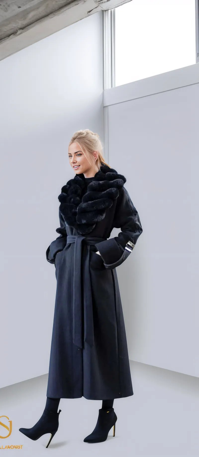 Elegant woman in a long black winter coat with a fur collar, showcasing stylish winter fashion for women.