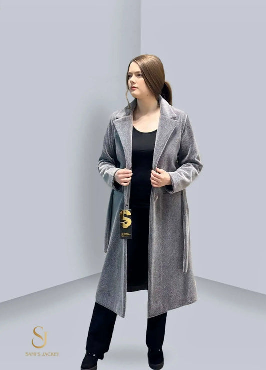 Stylish grey overcoat for women, perfect for winter layering and cold weather fashion. Ideal for casual or formal occasions.