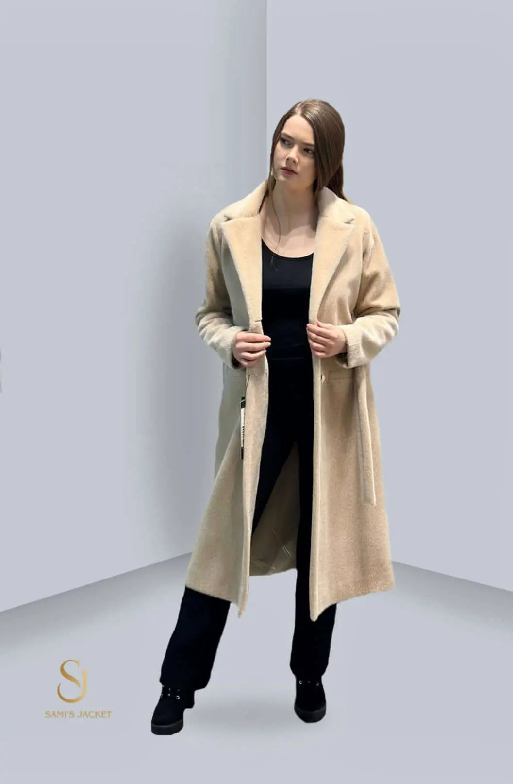 Model wearing a long beige winter jacket, showcasing style and versatility for women, perfect for colder seasons.