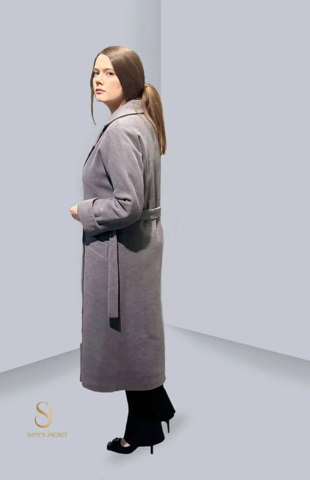 Stylish Model 1018 jacket in grey, featuring a tailored fit and belt, perfect for women's winter fashion.