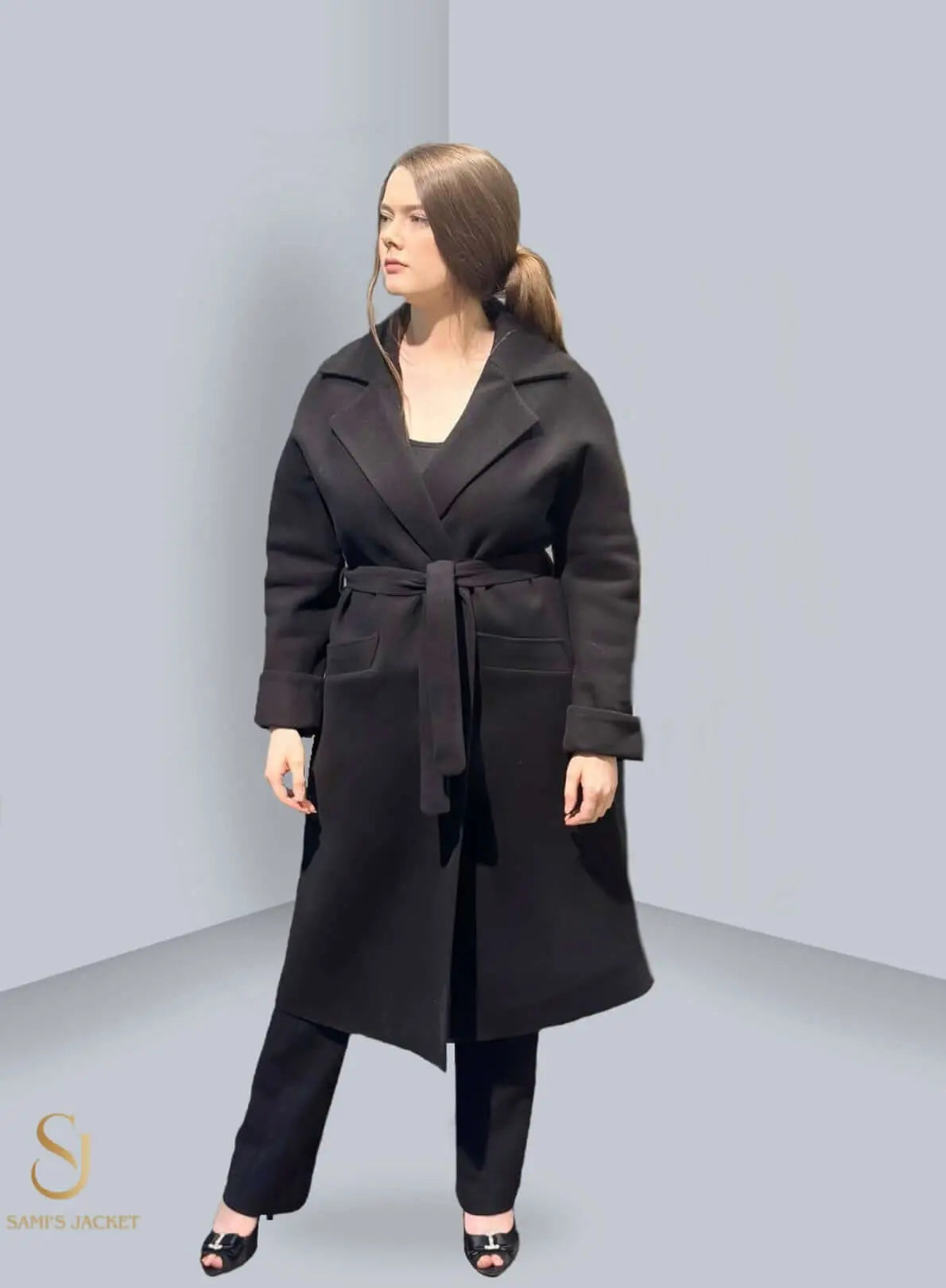 Stylish black Model 1018 jacket with belt, perfect for women's winter fashion, featuring a modern tailored fit.