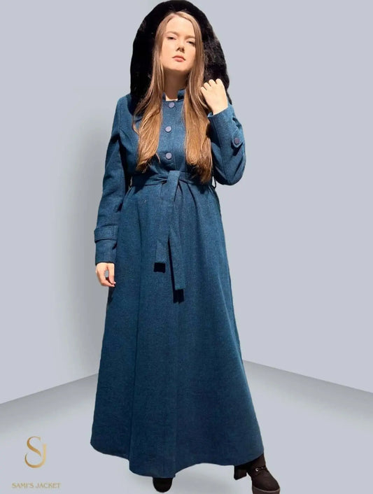 Model 1017 women's trench coat in blue with a fur hood, designed for winter style and warmth. Perfect for any occasion.