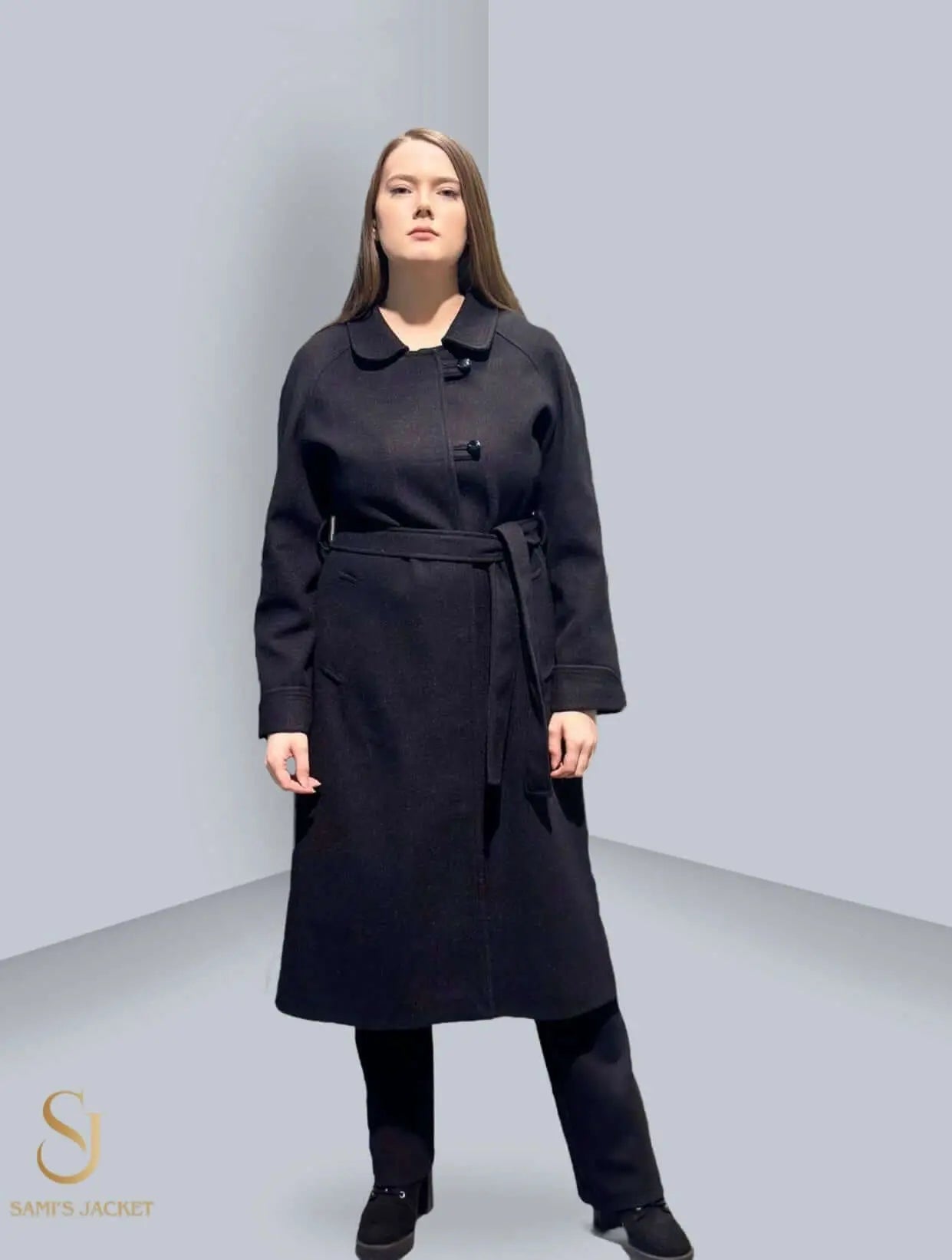 Stylish black women's winter coat with a belt, perfect for layering in colder seasons, showcasing modern design and tailored fit.