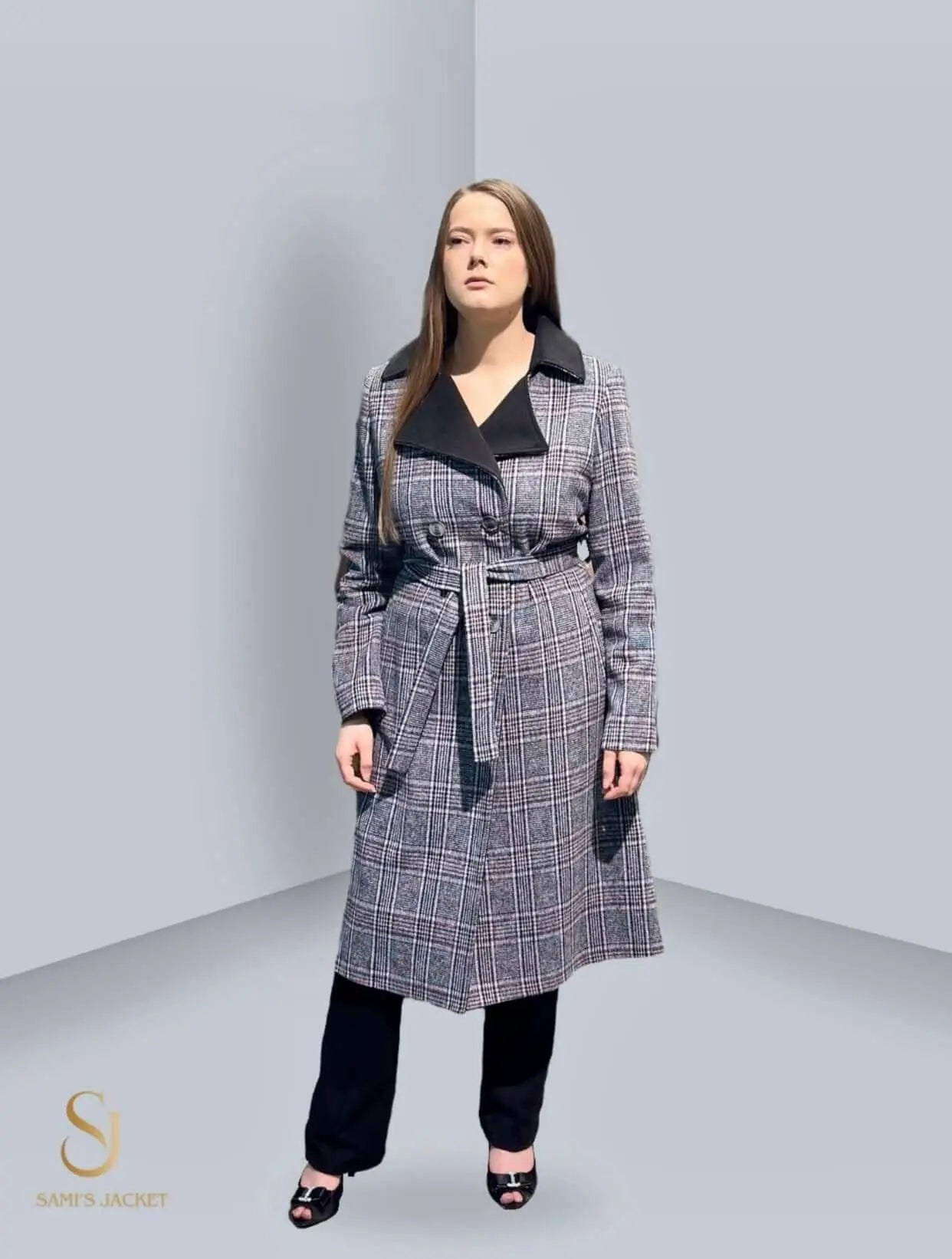 Woman in a stylish plaid winter coat with a belt, showcasing a modern design and tailored fit. Ideal for cold weather fashion.