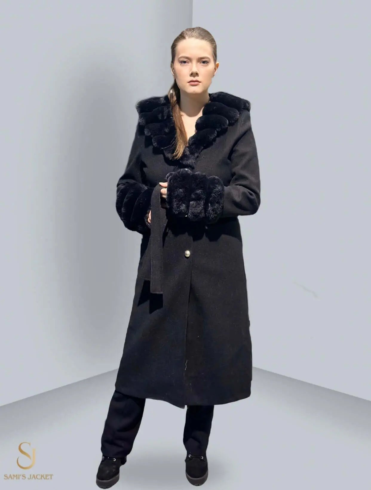 Elegant black winter coat with fur trim, perfect for women’s fashion, ideal for cold weather and stylish outings.