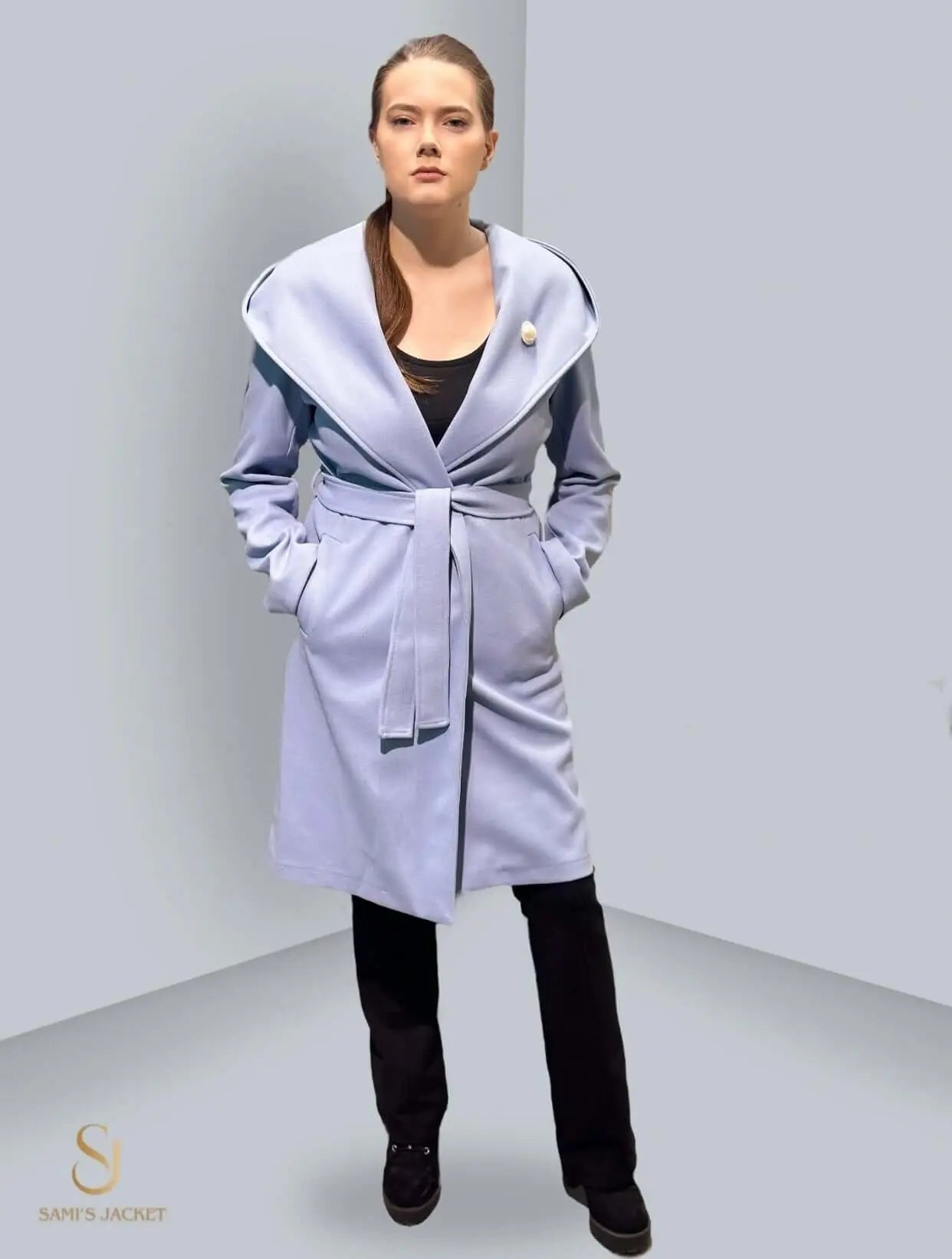 Stylish blue long winter jacket with a wrap belt, perfect for women seeking warmth and elegance. Ideal for casual or formal wear.