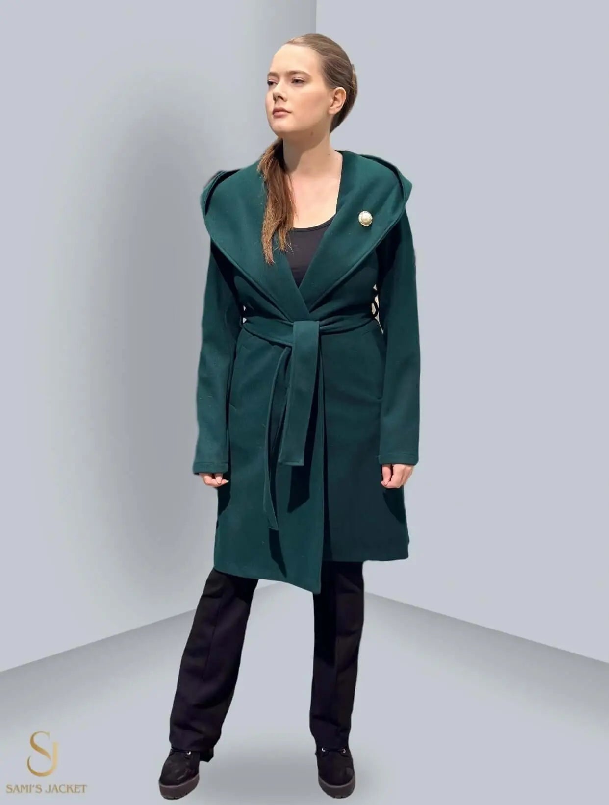 Stylish green winter jacket with a belt and hood, perfect for women, combining warmth and elegance for any occasion.