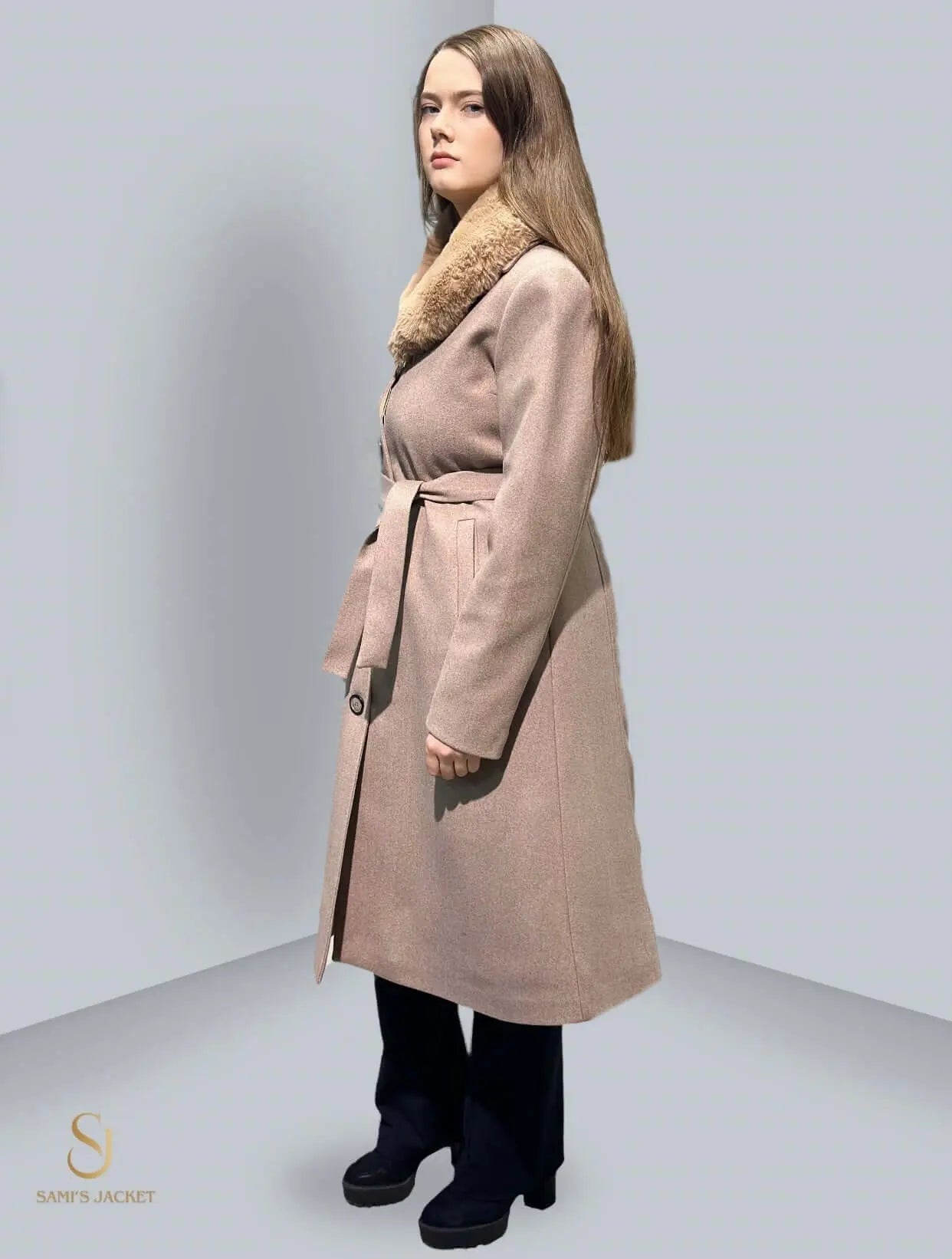 Stylish long winter coat with a belted waist and fur collar, ideal for women's winter fashion and layering.