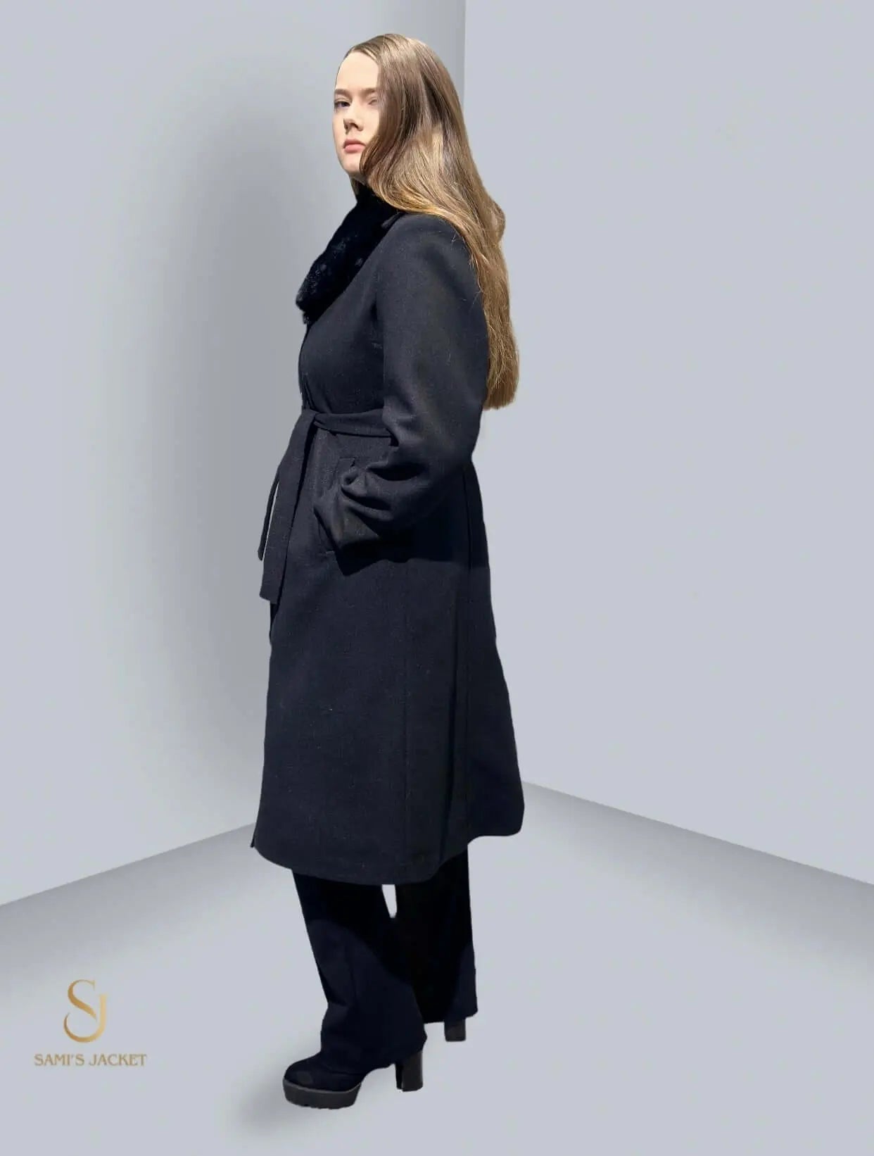 Model wearing a stylish black winter coat with a belt and fur collar, perfect for women's winter fashion.