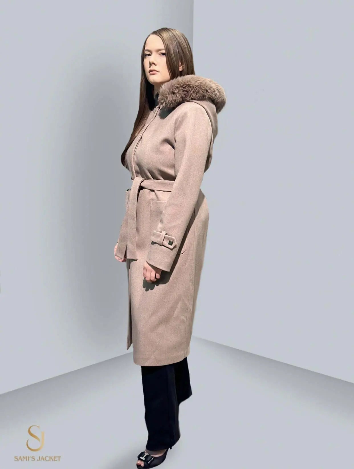 Elegant women's winter jacket with a hood and belt, perfect for layering in cold weather, showcasing modern style and comfort.