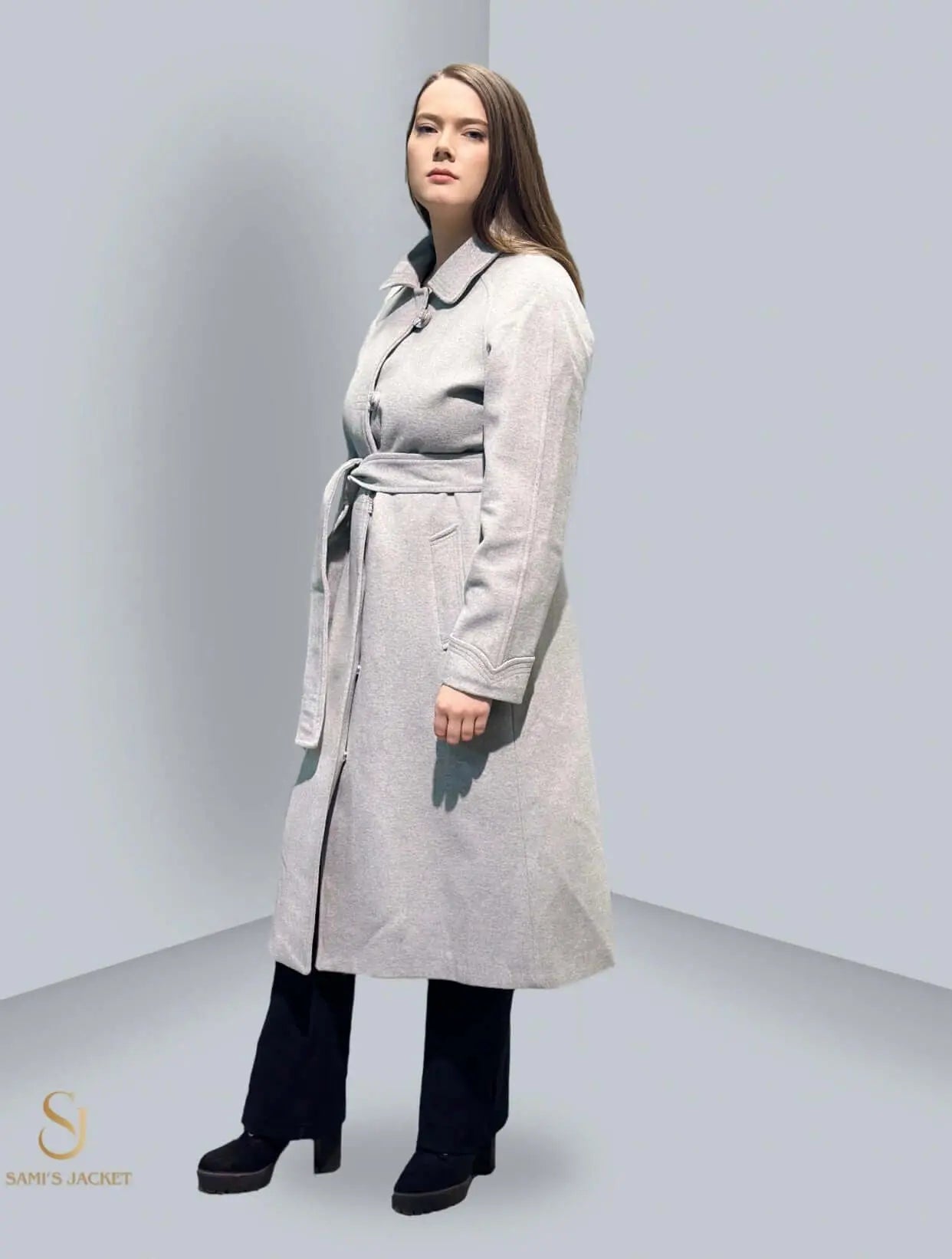 Stylish women's gray winter jacket with a belt, perfect for layering in colder seasons. Ideal for casual or formal wear.