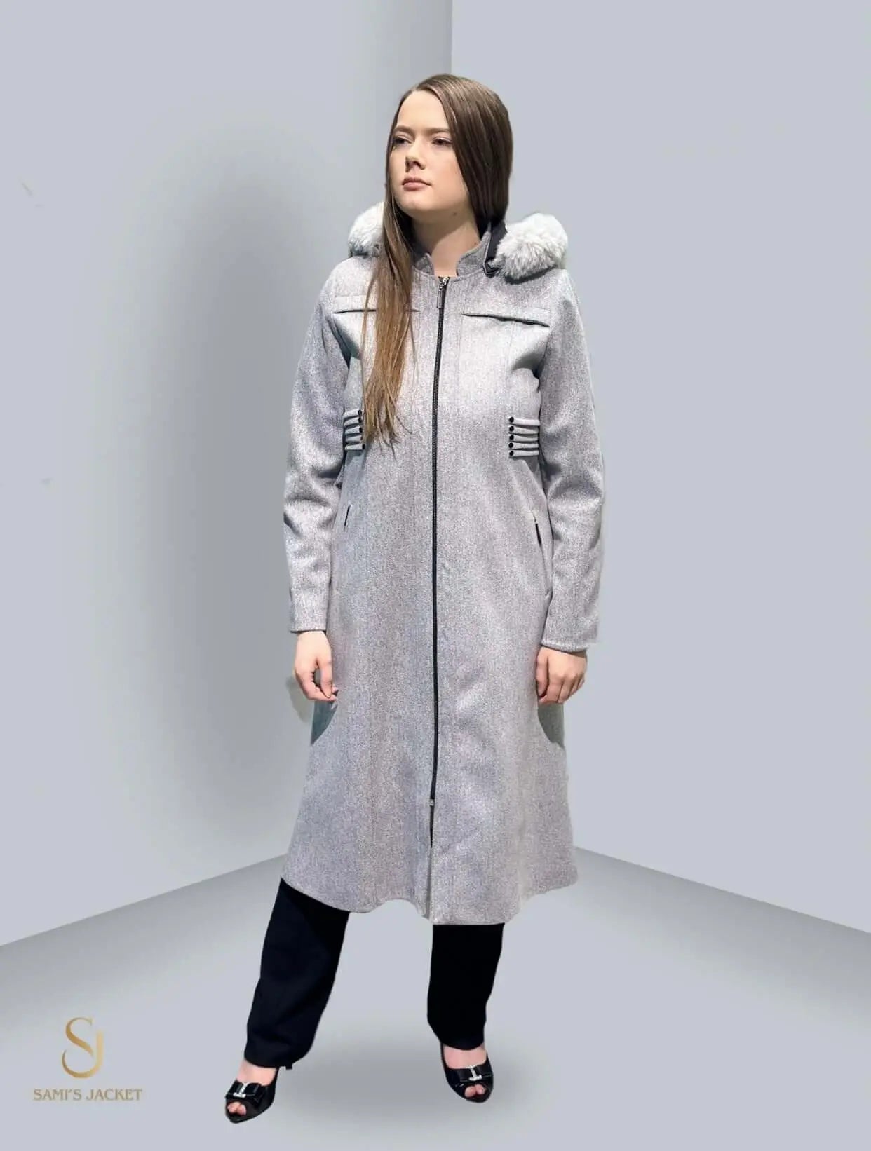 Stylish woman in a long gray winter jacket with a hood, perfect for cold seasons and practical layering.