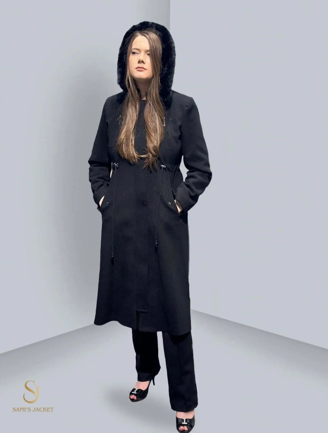 Stylish black winter coat with a hood, perfect for layering and versatile for casual and formal outings.