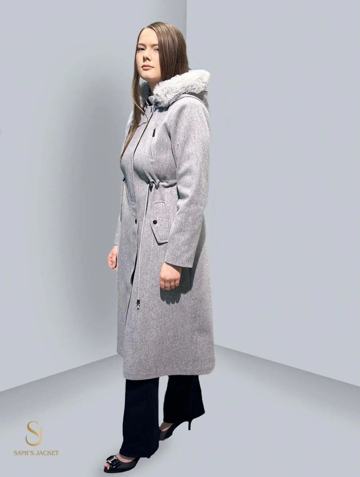 Stylish long grey winter coat with hood, perfect for women’s winter fashion and layering.