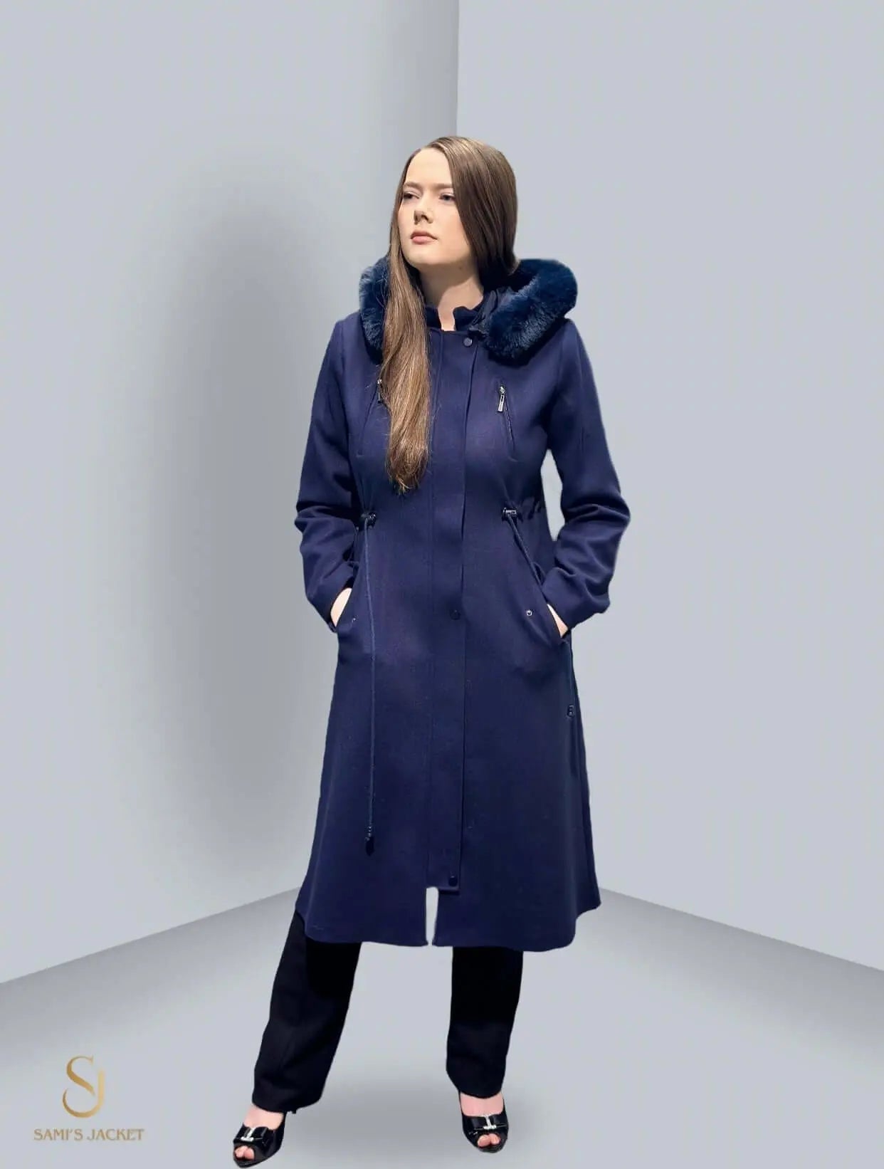 Stylish navy blue winter jacket with a fur-lined hood, perfect for women’s winter fashion and layering.