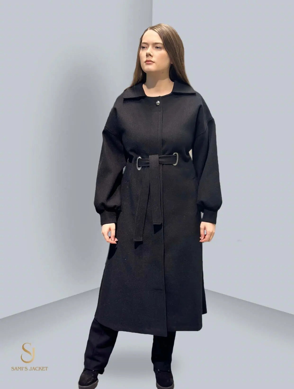 Elegant black long winter coat for women, featuring a belted waist and sophisticated design for cold weather fashion.