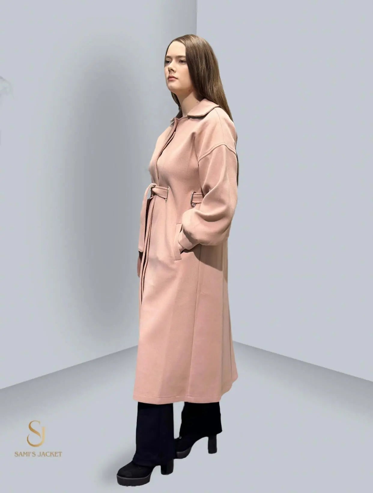 Elegant long pink winter coat with a belt, perfect for stylish women’s winter fashion. Ideal for cozy, chic looks.