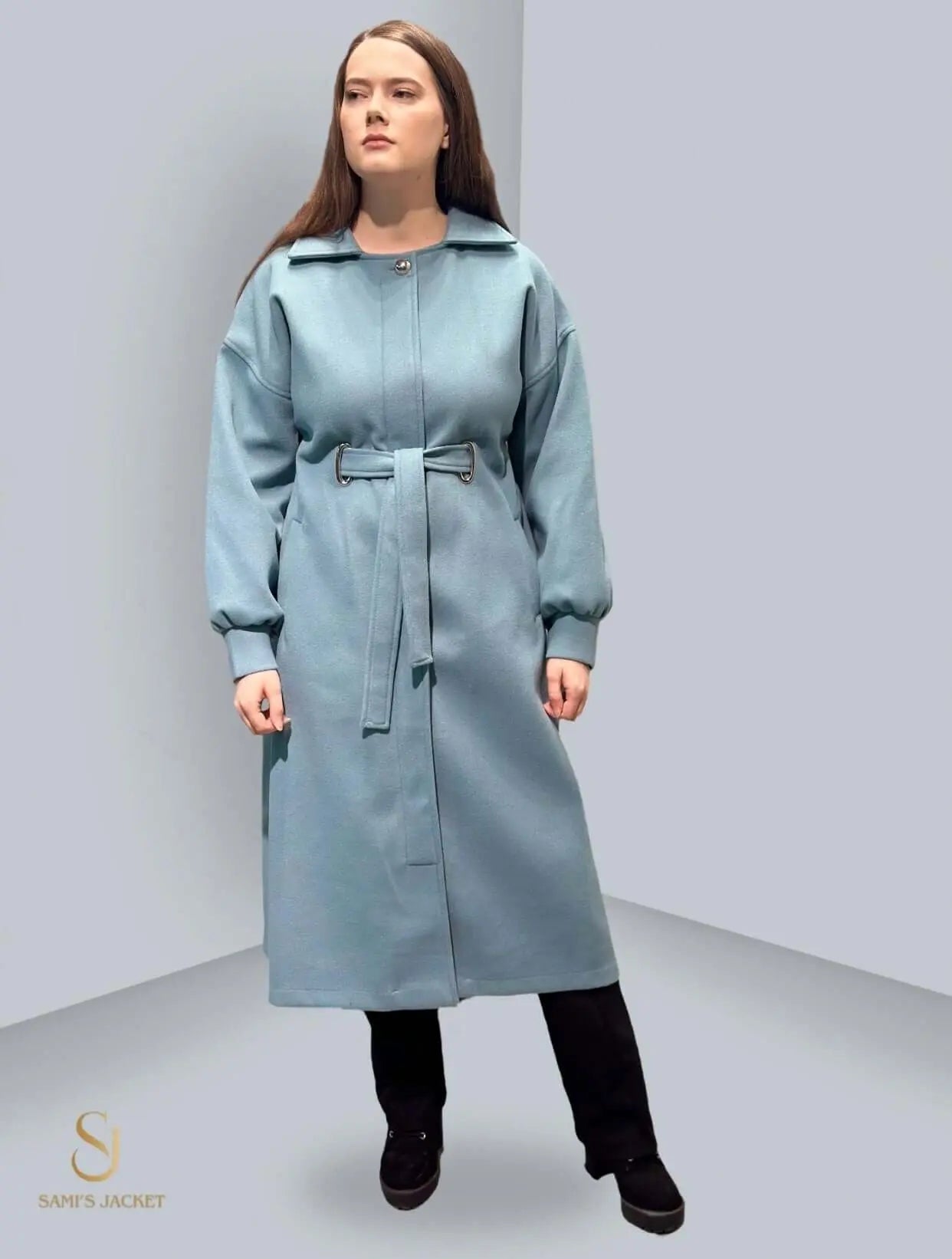 Model 1030 long winter coat in blue, featuring a belted design and elegant silhouette, perfect for women in cold weather.