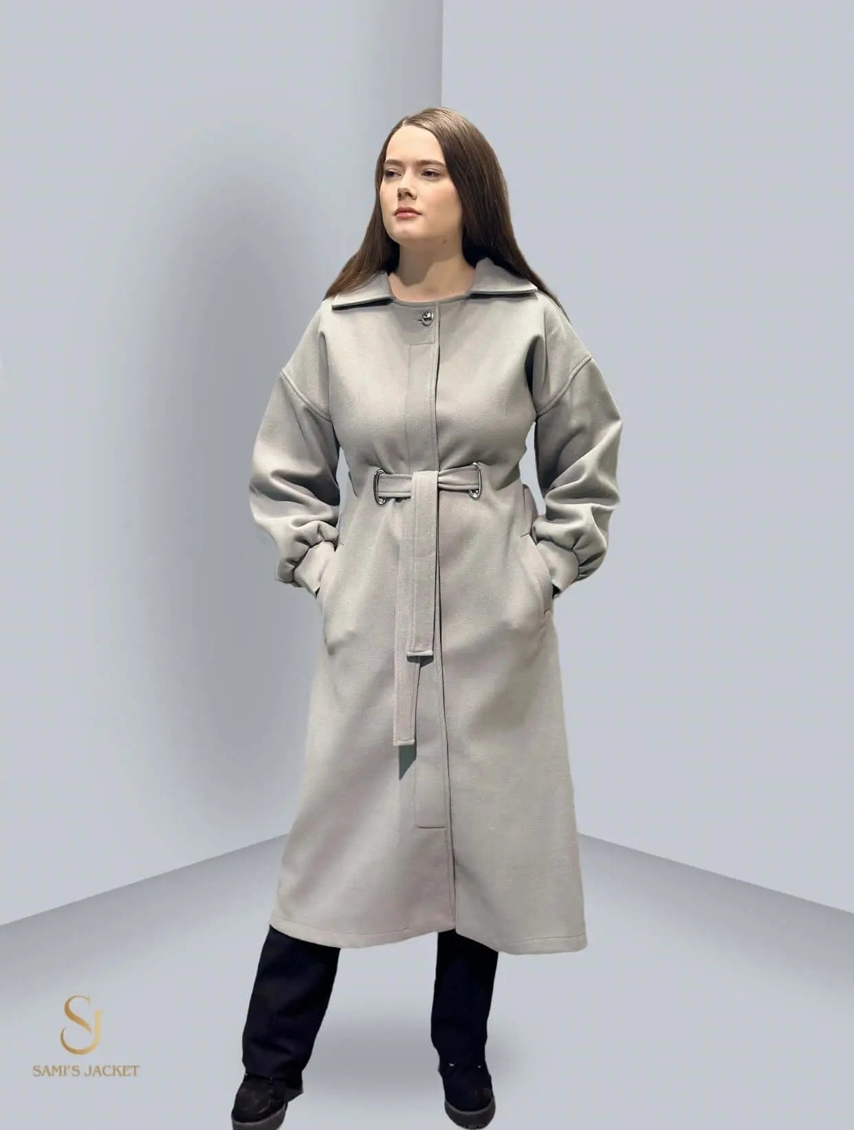 Stylish long winter coat for women, featuring a belted design and cozy fabric, perfect for cold weather fashion.