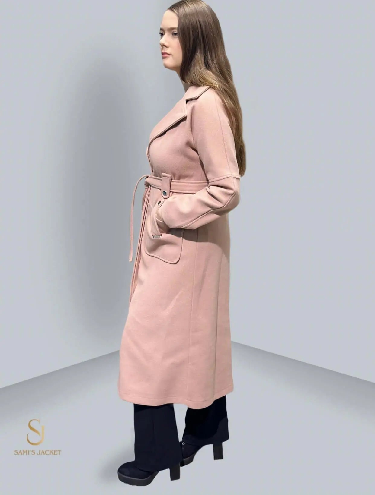 Stylish women's winter coat in soft pink, featuring a belted waist and elegant silhouette, perfect for formal occasions.